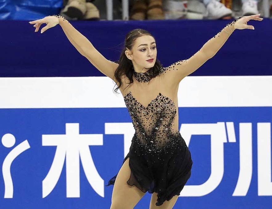 Ava Ziegler extending both arms through a skating performance