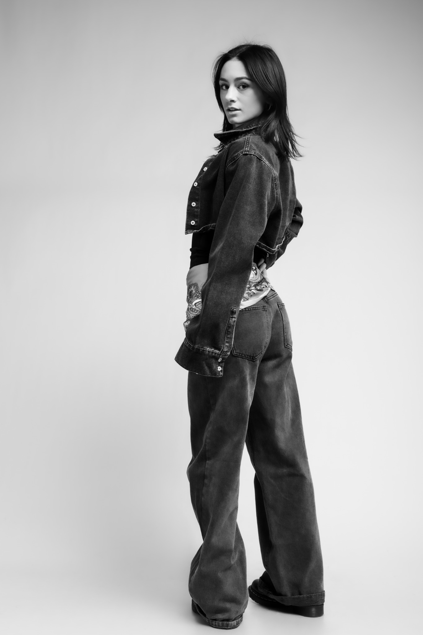 Ava Ziegler in a black-and-white full-length fashion portrait